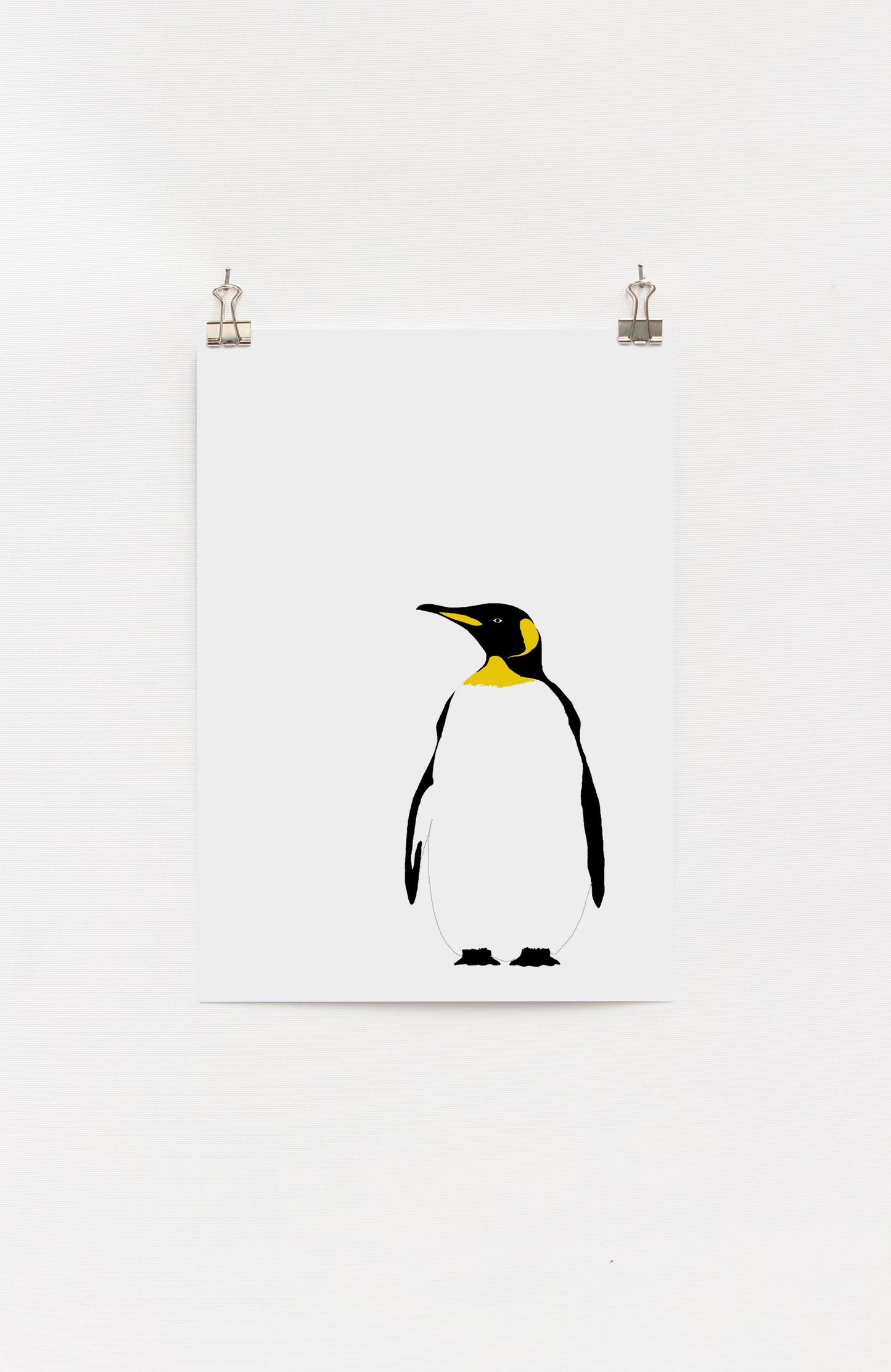 A framed digital print of an elegant penguin looking into the distance, predominantly in white, yellow, and black colors.