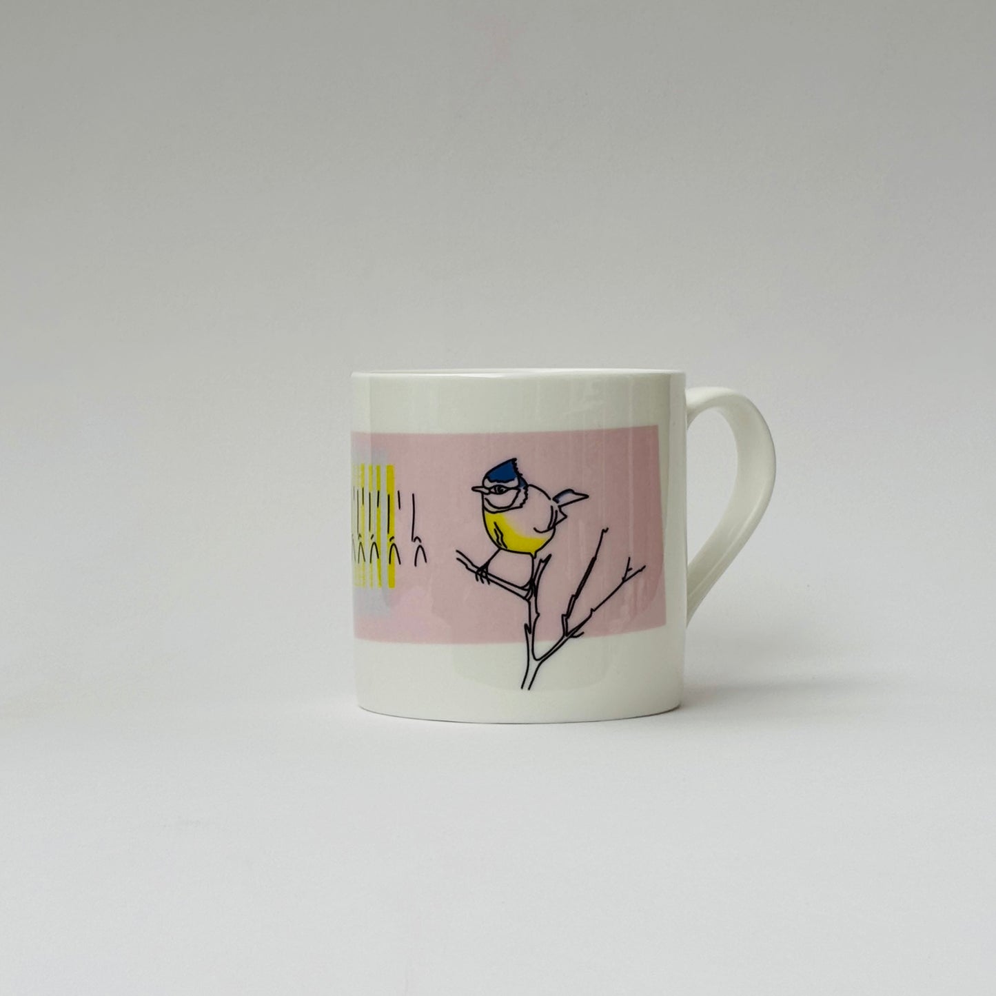 Mug with a bird design on a pink background