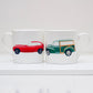 Two mugs with car illustrations on a white surface