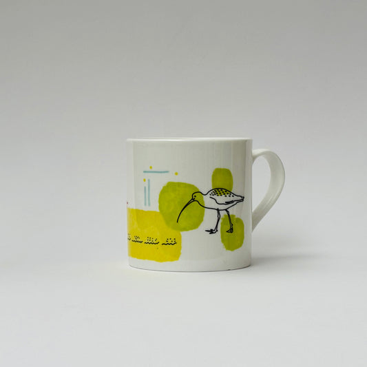 White mug with a bird illustration on a white background