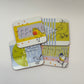 Four coasters with bird illustrations on a white background