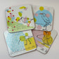 Set of four colorful coasters with bird illustrations on a white background
