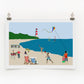 A digital print featuring a colorful beach scene with people engaging in various activities such as sunbathing, playing beach games, and fishing.