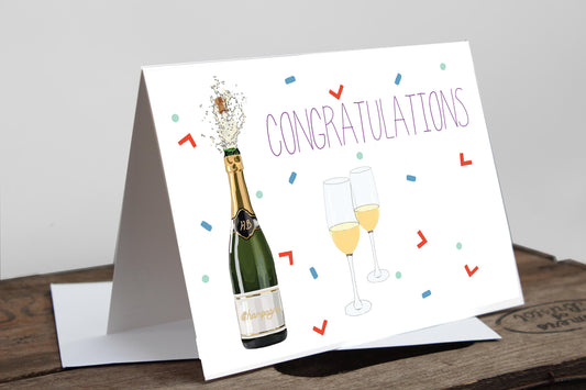 A greetings card with a 'CONGRATULATIONS' text, featuring an illustration of a champagne bottle and glass, and decorated with multicolored confetti and decorative lines.