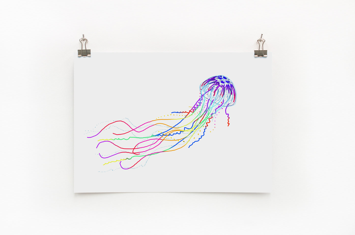 A digital print of a colorful jellyfish on a white background, displayed on a wall.