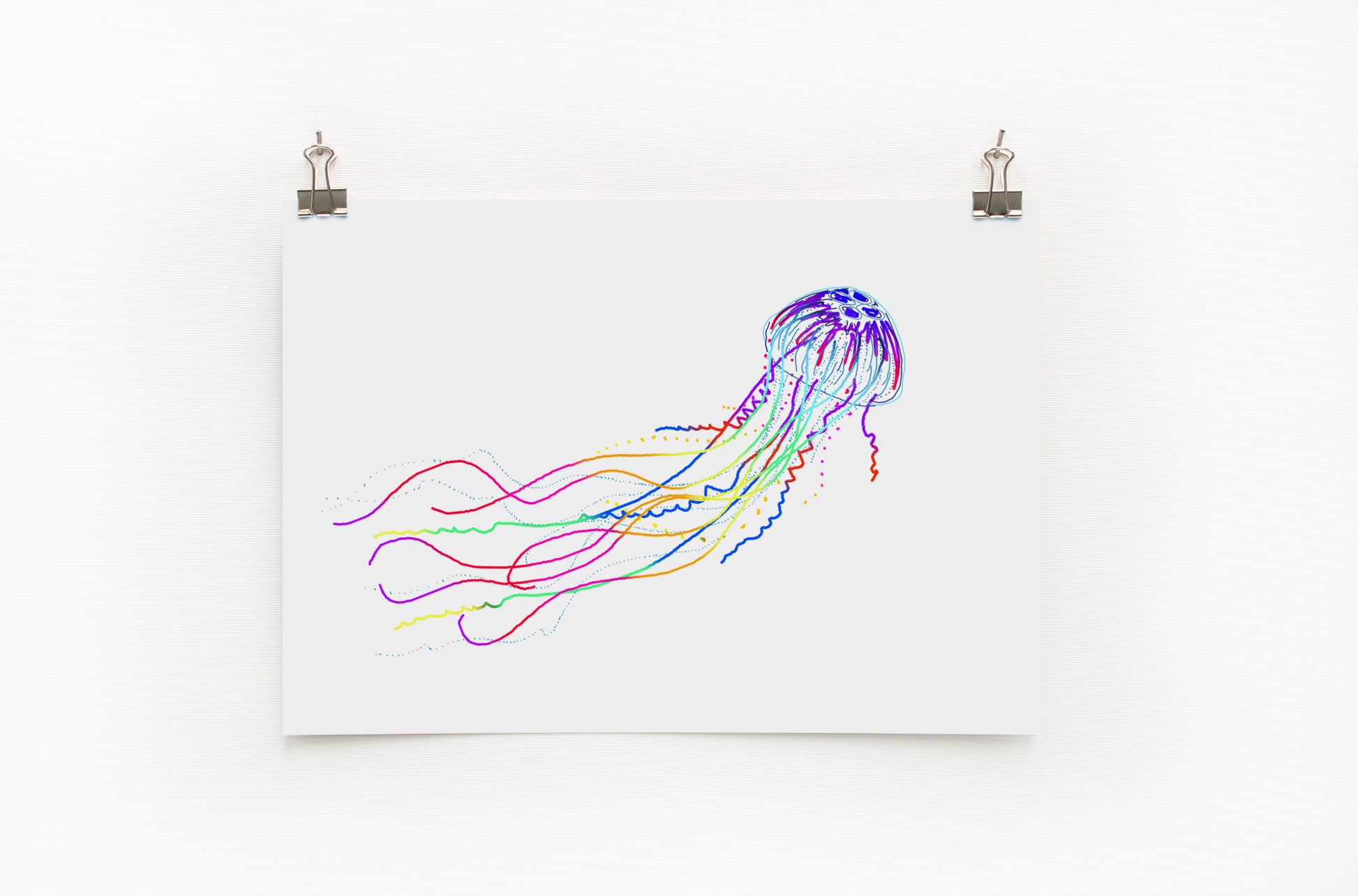 A digital print of a colorful jellyfish on a white background, displayed on a wall.