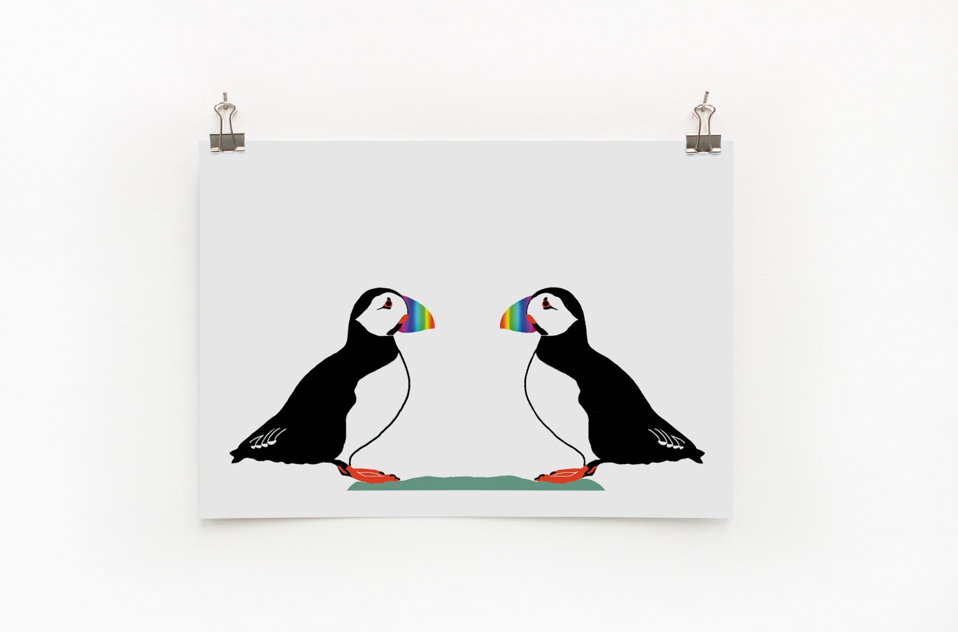 A digital print featuring two puffins with colorful rainbow beaks. The background is plain white.