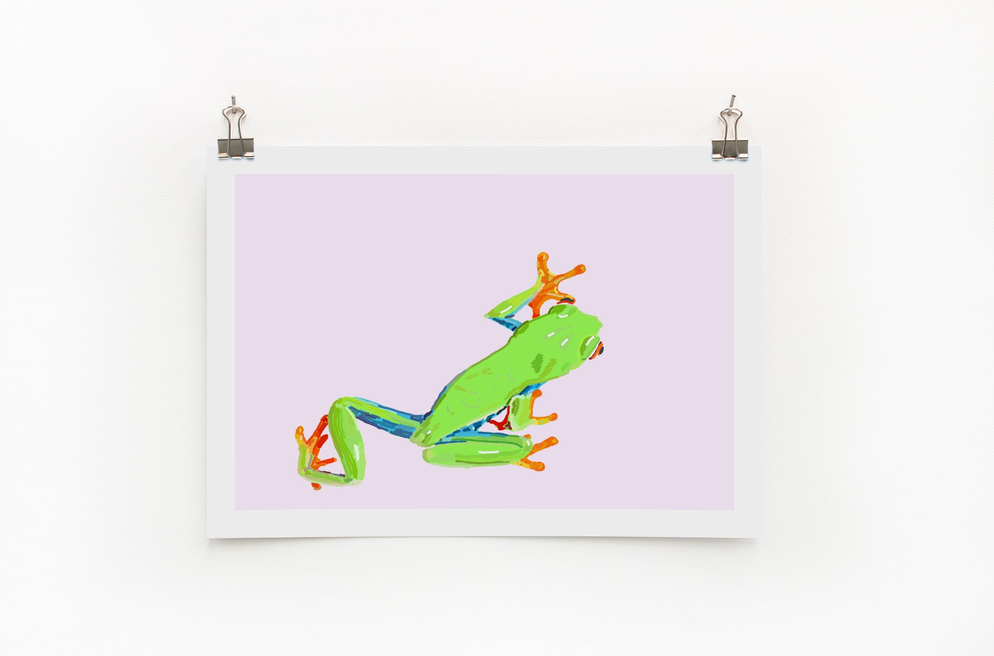 Digital print of a green and orange tree frog on a purple background, framed and hanging on a wall.