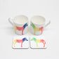 Two square coasters with a multicolored zebra pattern on a white background, displayed on a white surface.